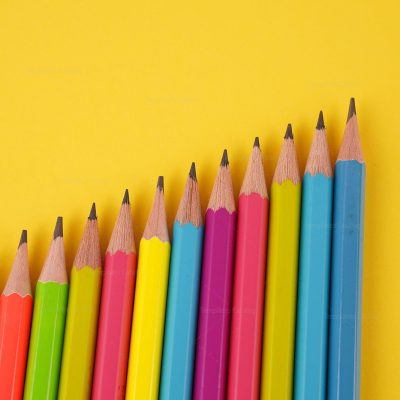 Color-pencils-on-yellow-background